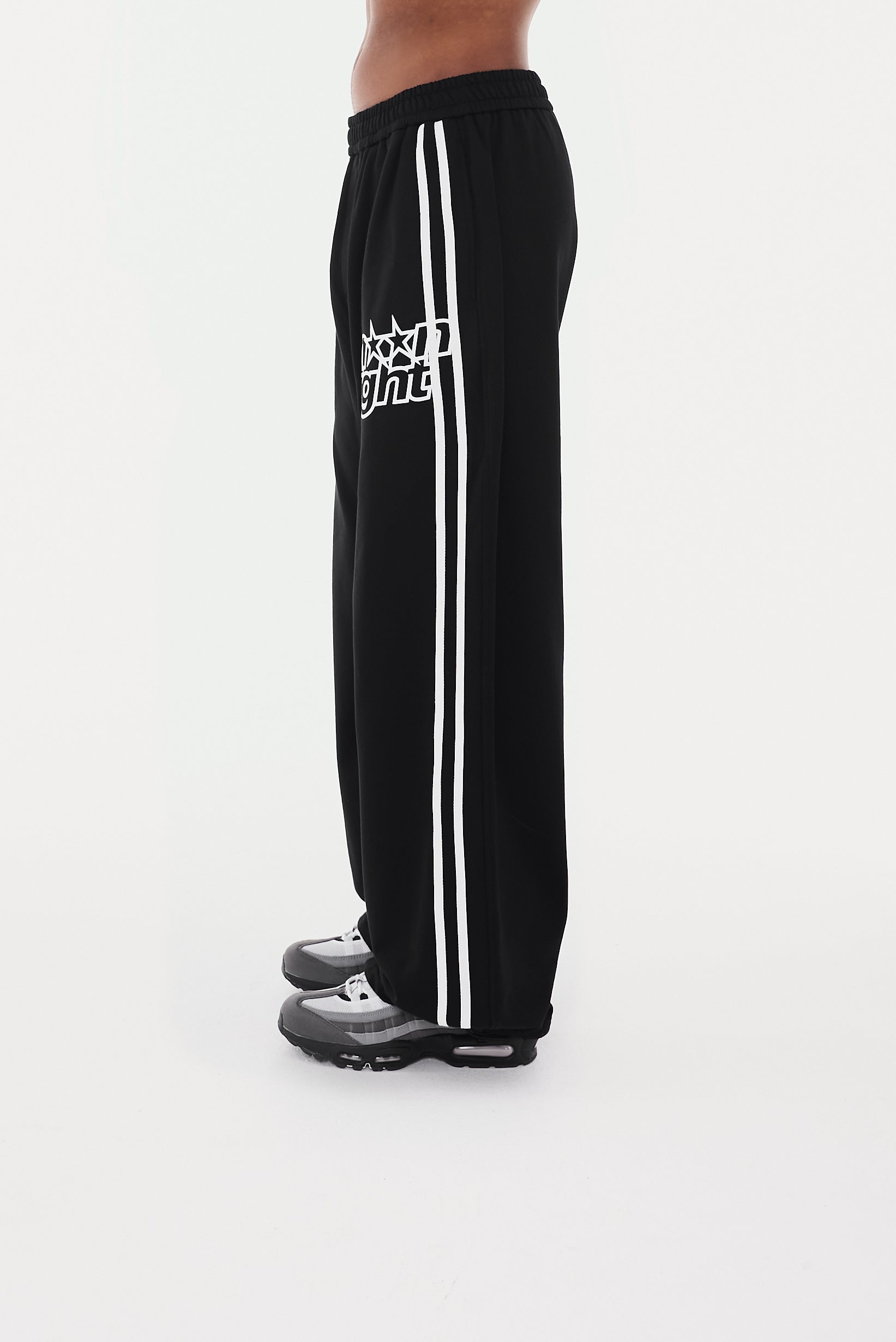 White sweatpants with online black stars